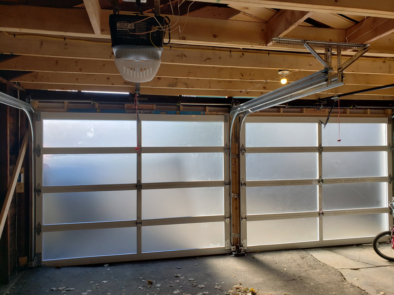Two door garage remodel with exposed beams inside